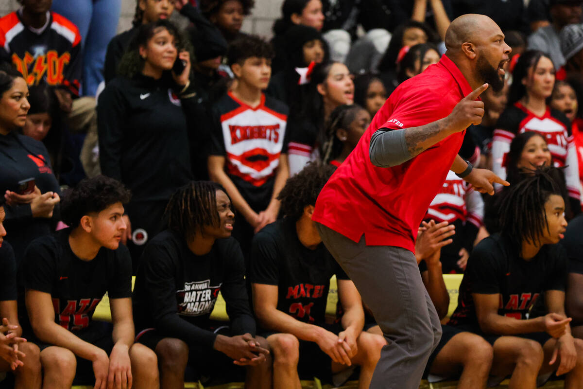 Mater Academy head coach Antoine Wright coaches his players from the sidelines during a boys ba ...