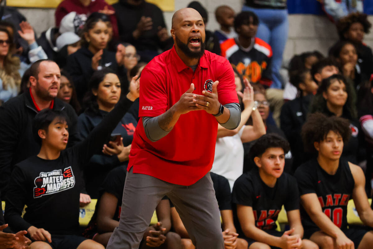 Mater Academy head coach Antoine Wright coaches his players from the sidelines during a boys ba ...