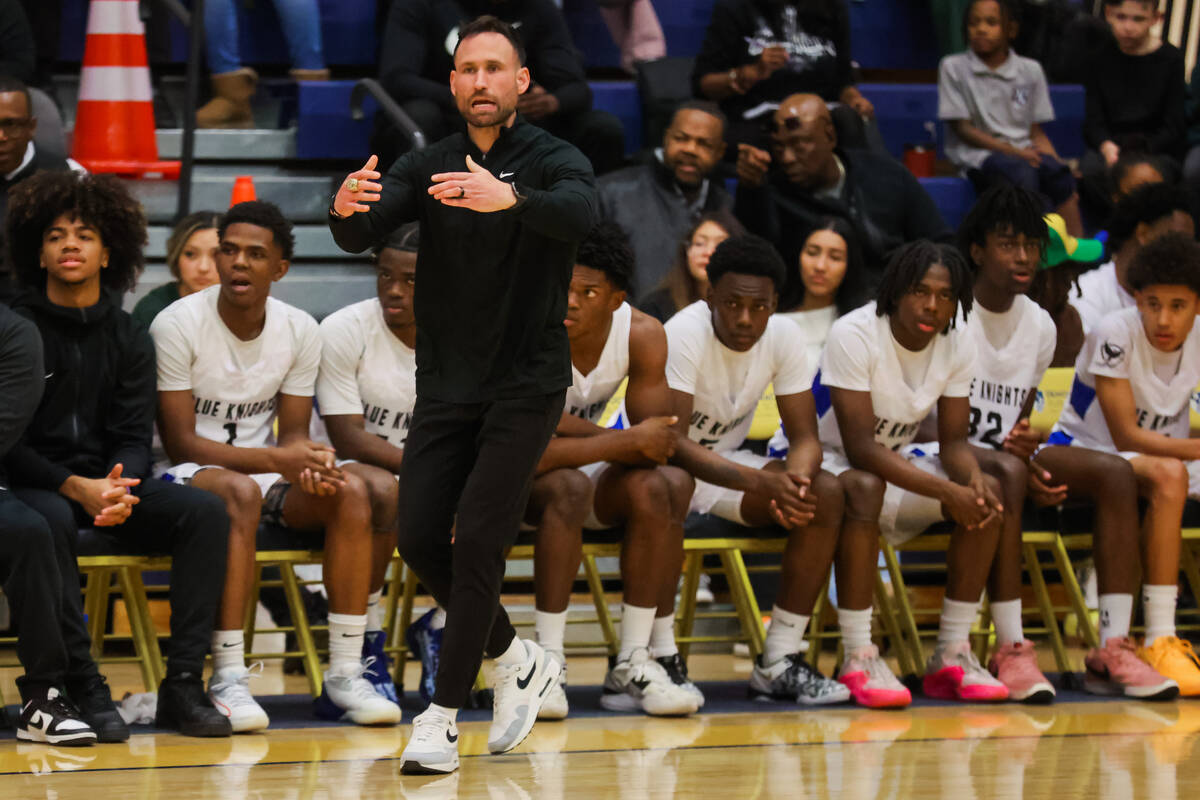 Democracy Prep head coach Cory Duke coaches from the sidelines during a boys basketball game be ...