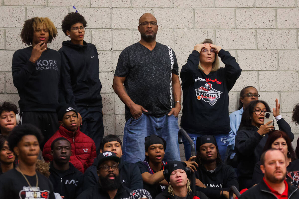 Mater East fans react from the bleachers during a boys basketball game between Mater East and D ...