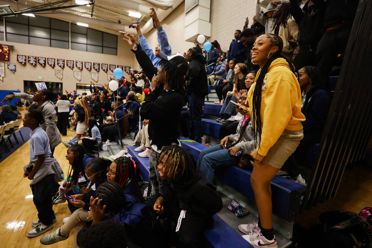 Democracy Prep fans cheer during a boys basketball game between Mater East and Democracy Prep a ...