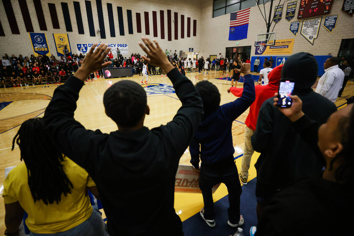 Democracy prep students wave goodbye to Mater East players in the final moments during a boys b ...