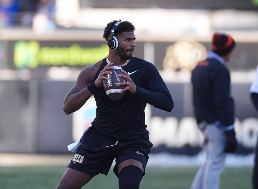 Colorado quarterback Shedeur Sanders (2) warms up before an NCAA college football game Friday, ...