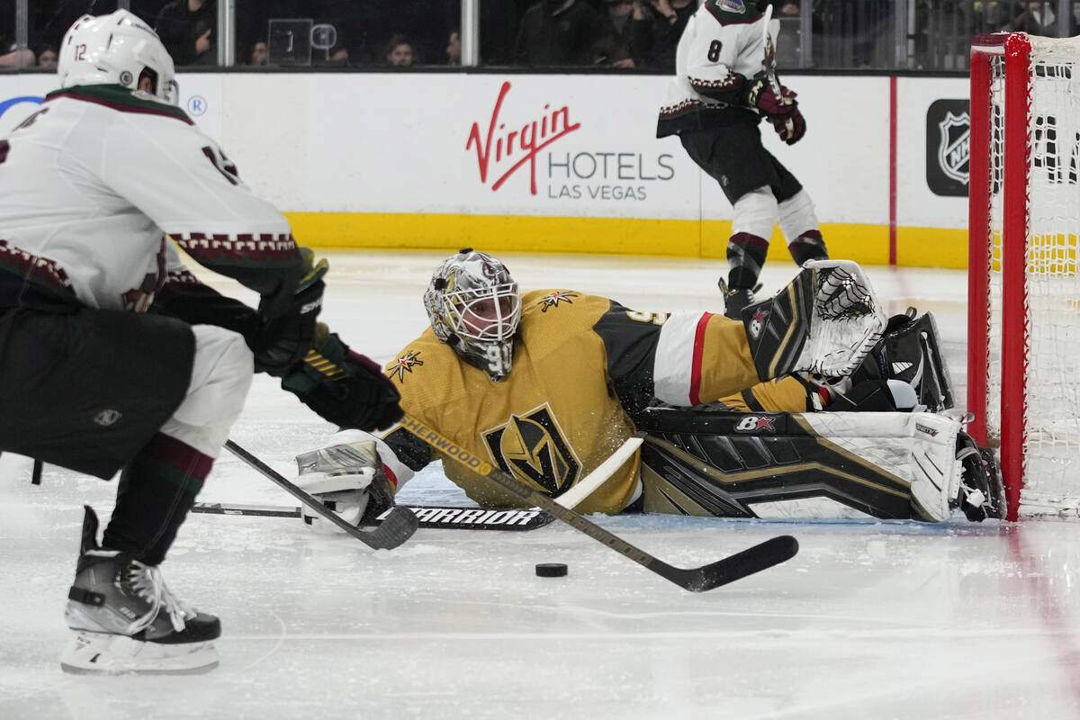 Vegas Golden Knights goaltender Robin Lehner (90) stops a shot by Arizona Coyotes left wing Nic ...