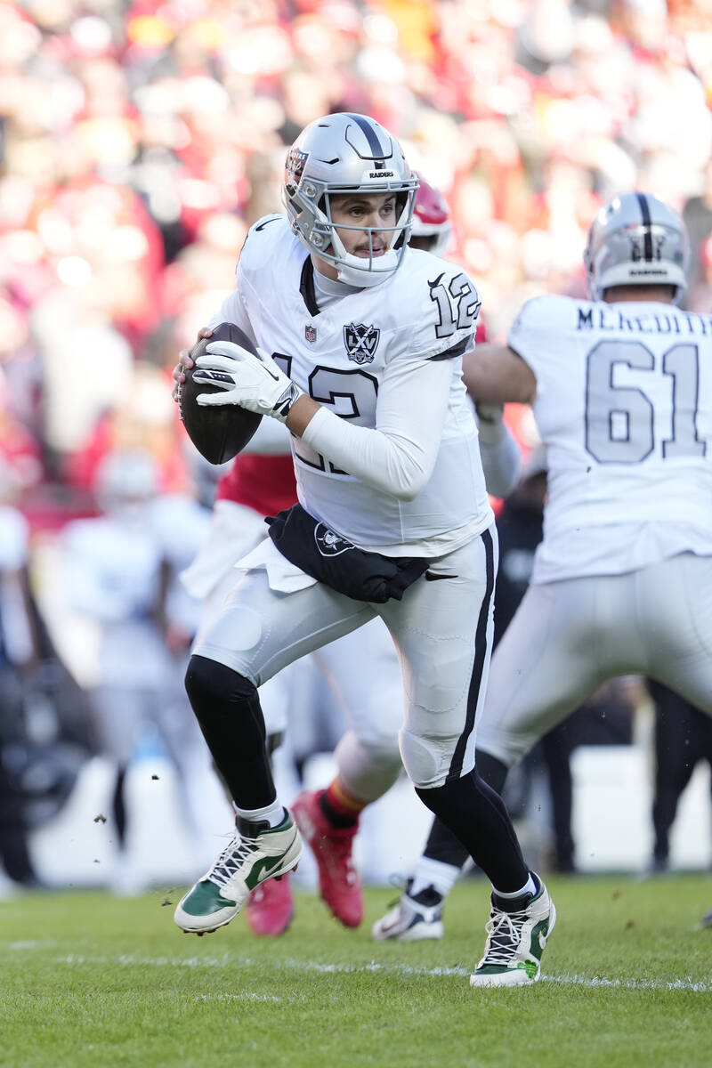 Las Vegas Raiders quarterback Aidan O'Connell drops back for a pass during an NFL football game ...