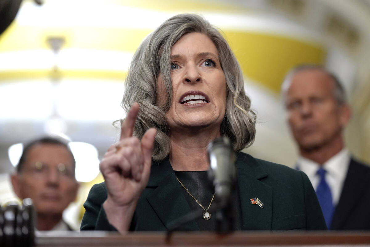 FILE - Sen. Joni Ernst, R-Iowa, talks after a policy luncheon on Capitol Hill, Sept. 24, 2024, ...