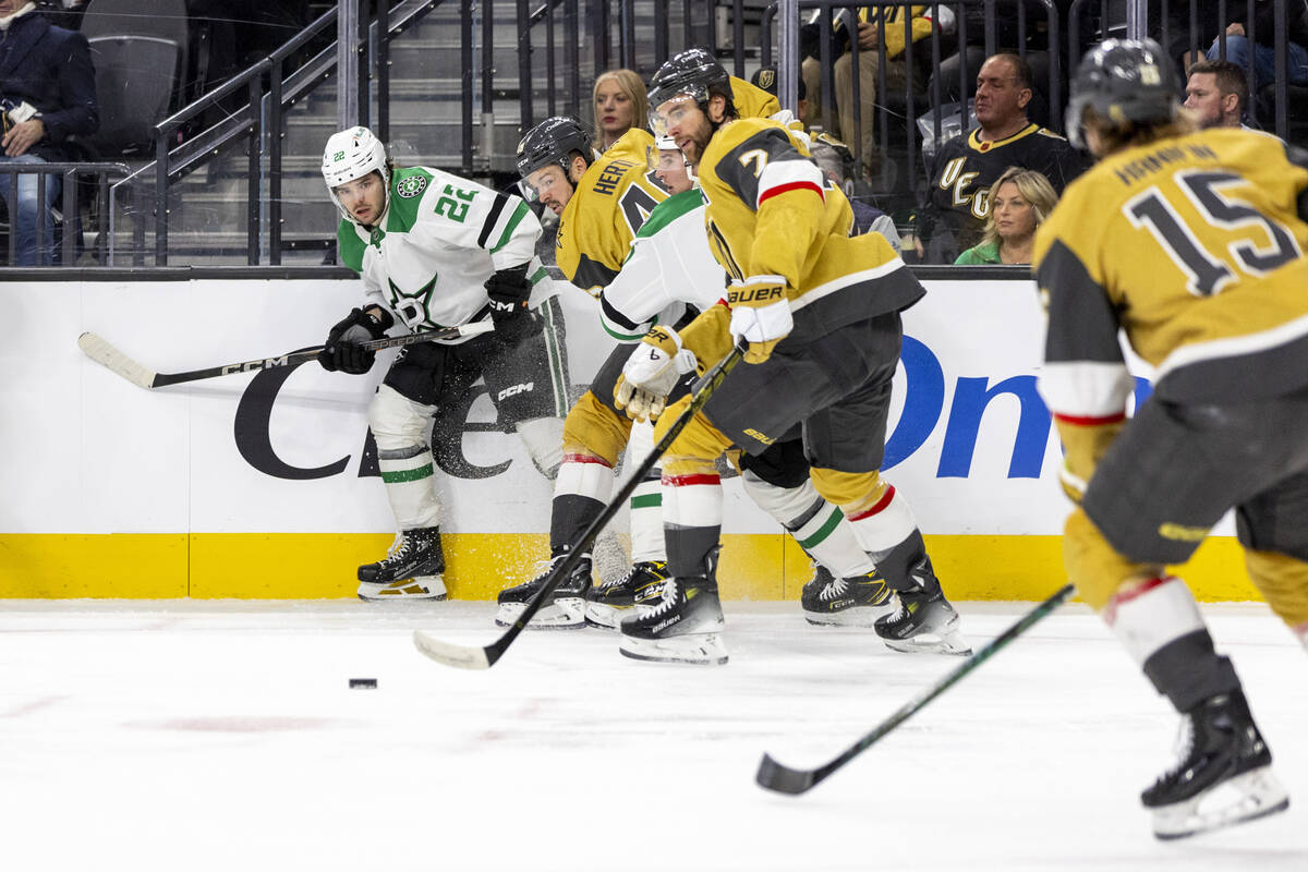 Golden Knights and Dallas Stars players compete for the puck during the second period of the NH ...