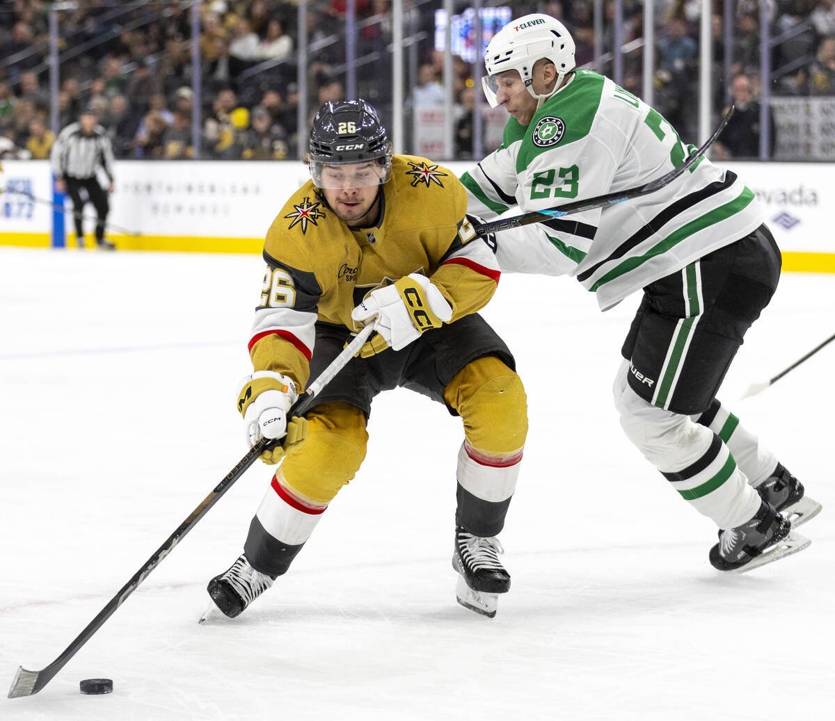 Golden Knights right wing Alexander Holtz (26) maneuvers around Dallas Stars defenseman Esa Lin ...