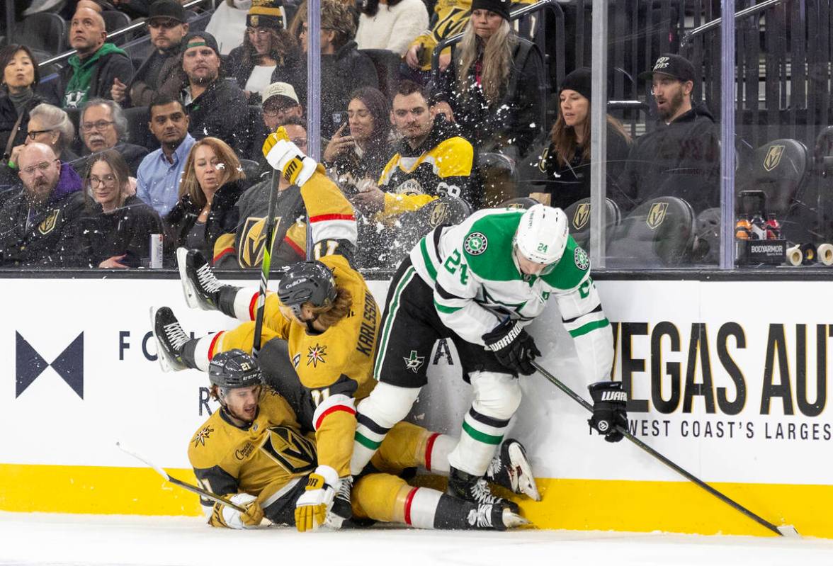 Dallas Stars center Roope Hintz (24) causes Golden Knights center William Karlsson (71) and Gol ...