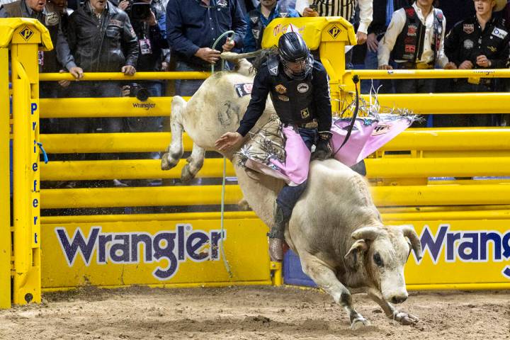 Jace Trosclair competes in the bull riding event during opening night of the National Finals Ro ...