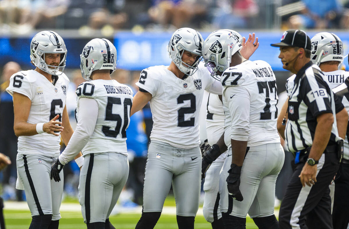 Raiders place kicker Daniel Carlson (2) is congratulated on a successful kick against the Los A ...