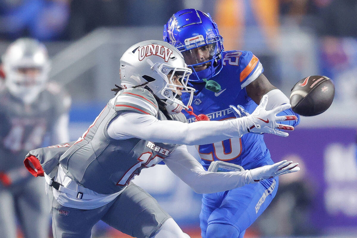 UNLV wide receiver Corey Thompson Jr., front left, reaches back for the ball against Boise Stat ...