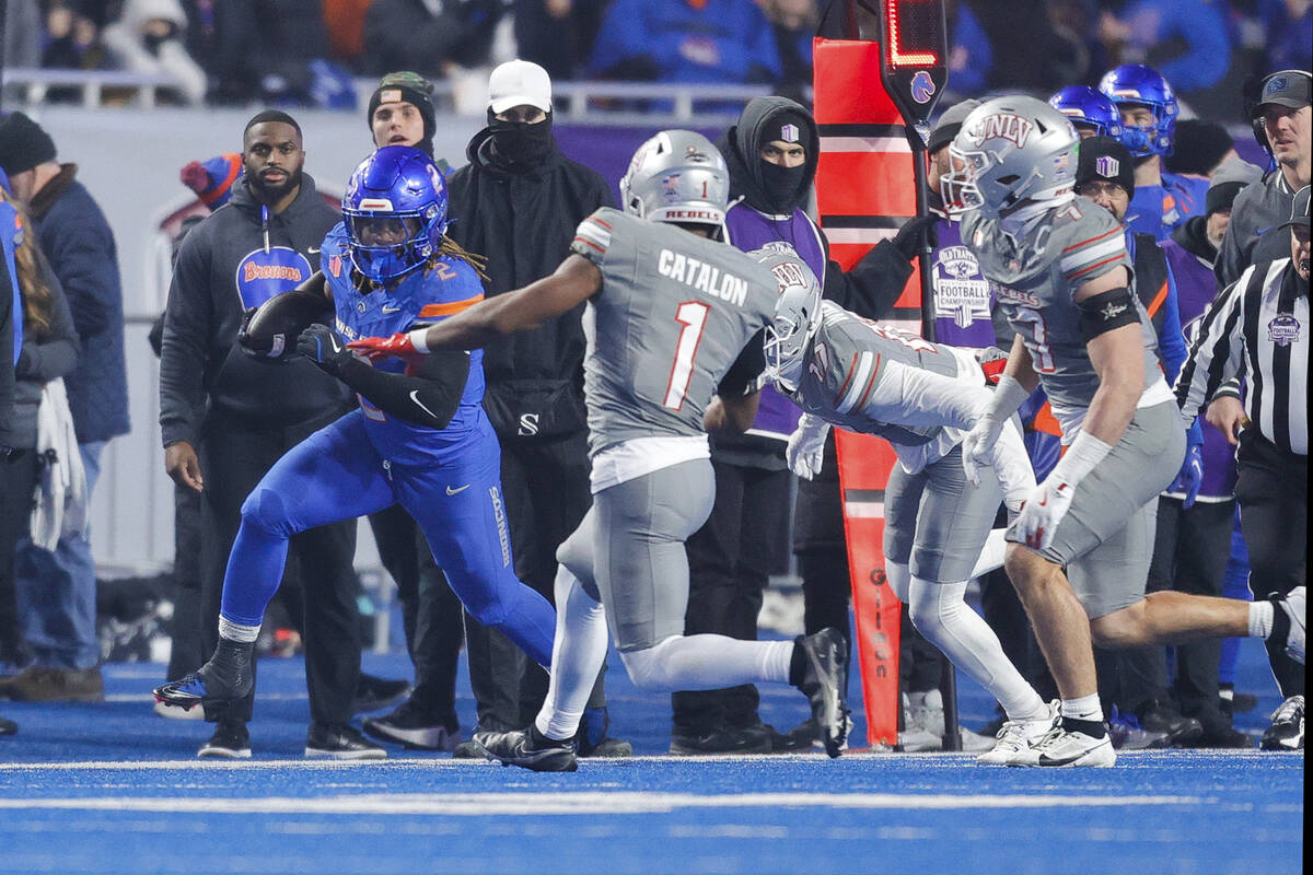 Boise State running back Ashton Jeanty (2) runs up the sidelines with the ball in front of UNLV ...