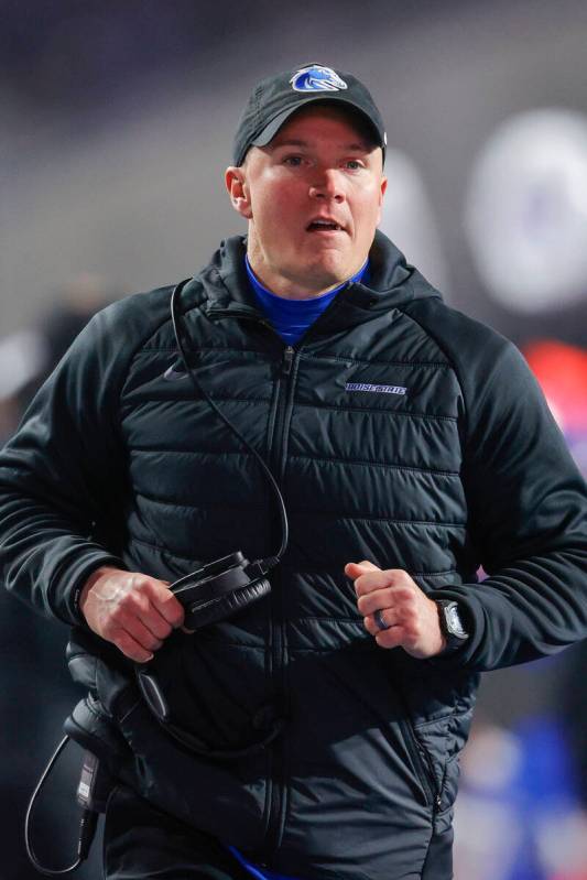 Boise State head coach Spencer Danielson runs to check on a injured player in the second half o ...