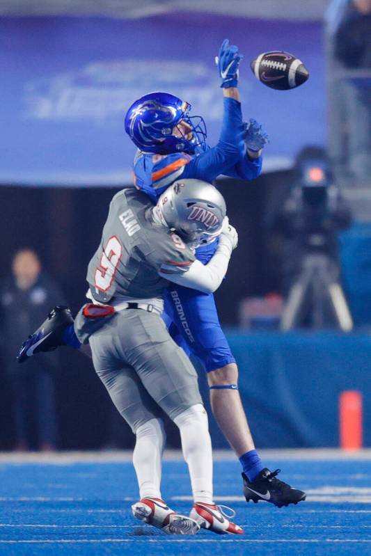 UNLV defensive back Jett Elad (9) hits Boise State wide receiver Austin Bolt (81) to break up a ...