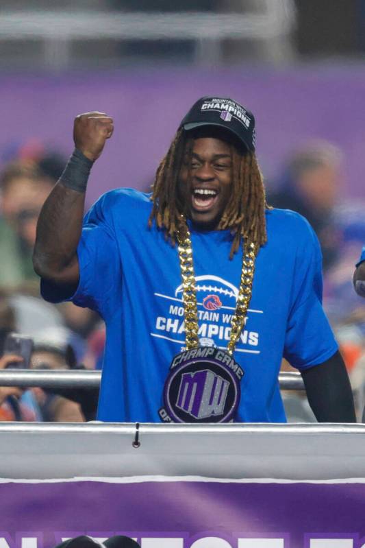 Boise State running back Ashton Jeanty celebrates after winning the offensive player of the gam ...