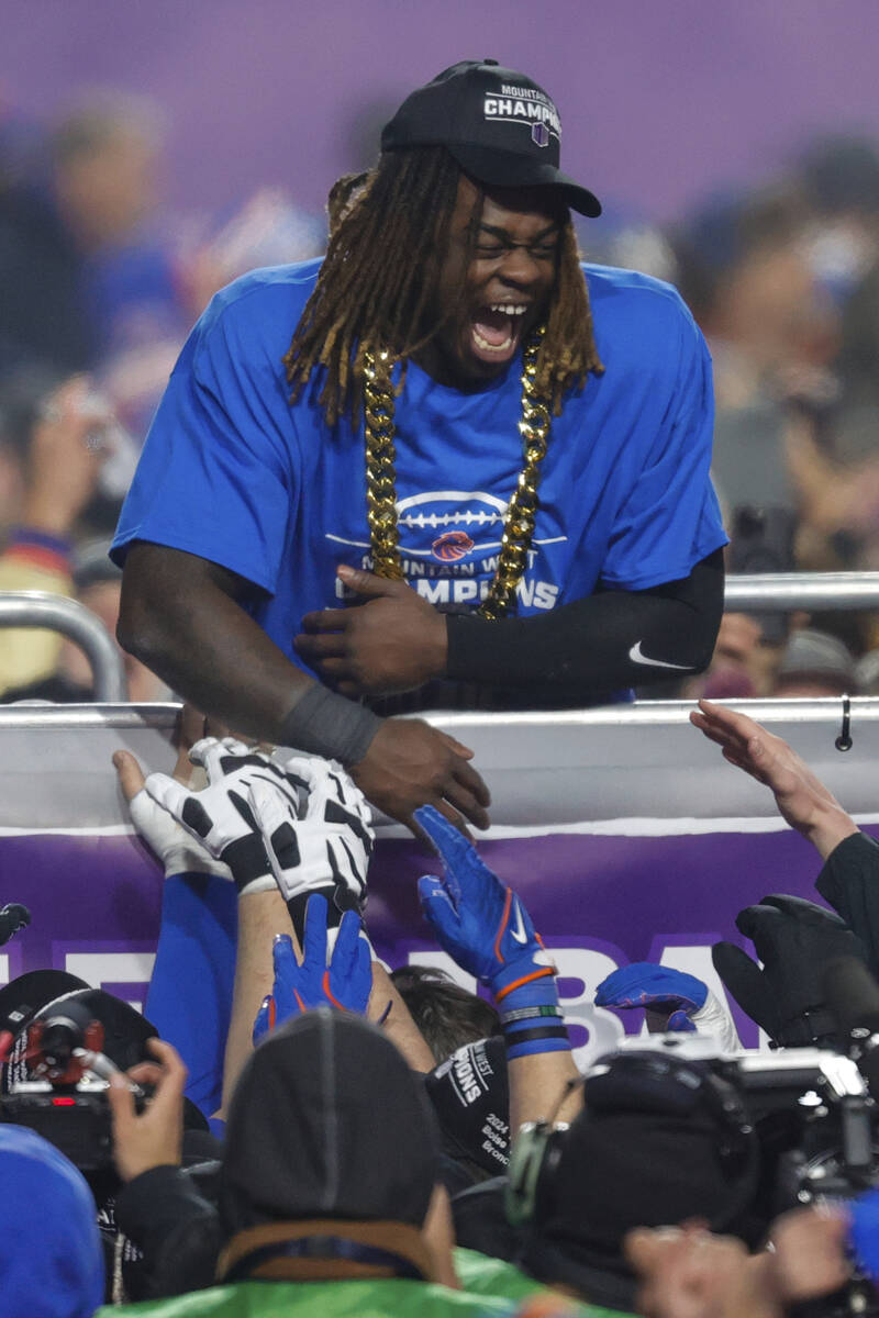 Boise State running back Ashton Jeanty celebrates with teammates after winning the offensive pl ...