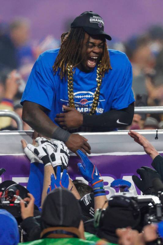 Boise State running back Ashton Jeanty celebrates with teammates after winning the offensive pl ...