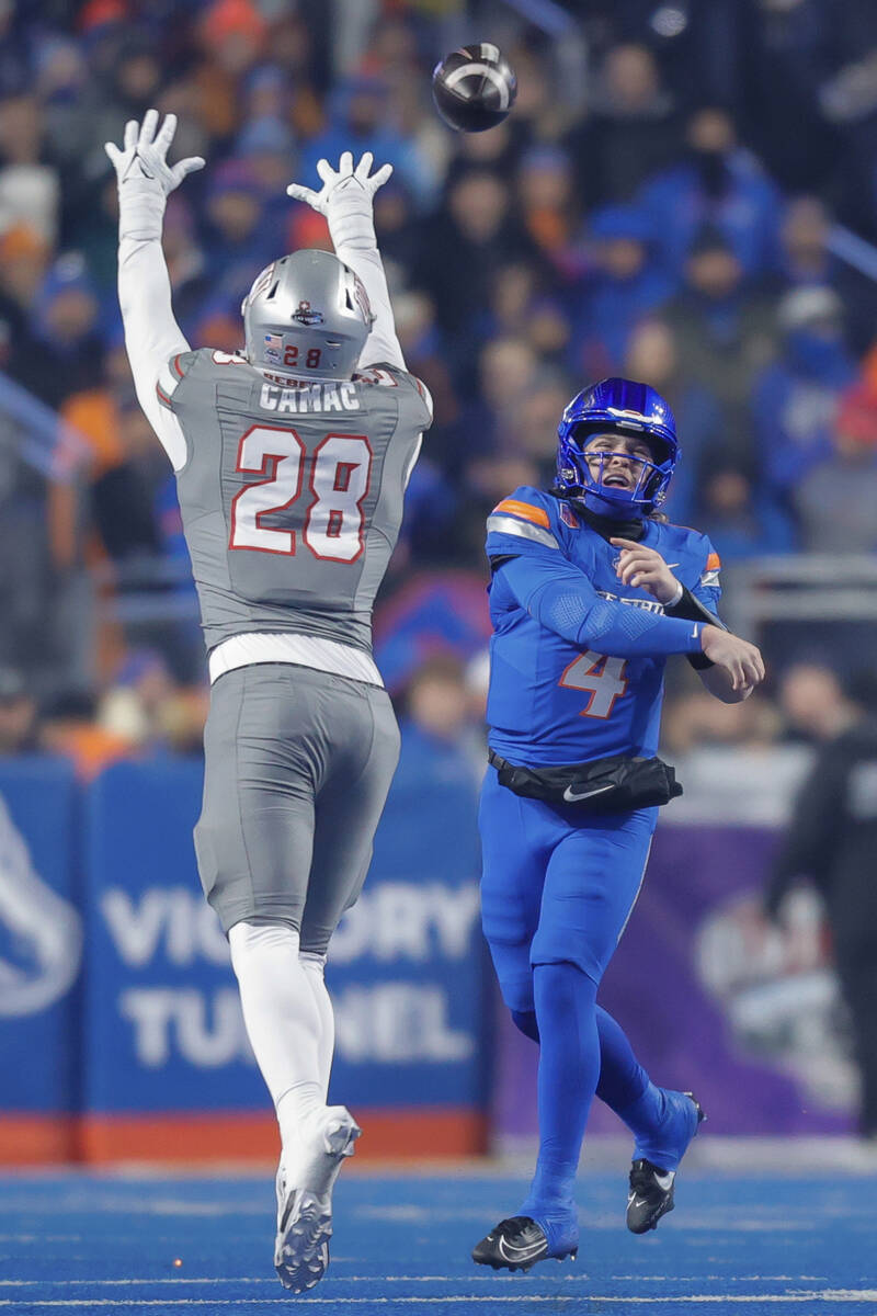 Boise State quarterback Maddux Madsen (4) throws the ball over UNLV defensive lineman Fisher Ca ...