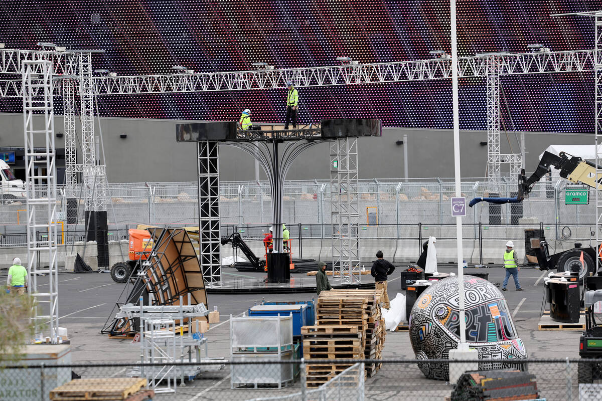 Workers dismantle the Formula One Las Vegas Grand Prix track off Sands Avenue near Sphere in L ...