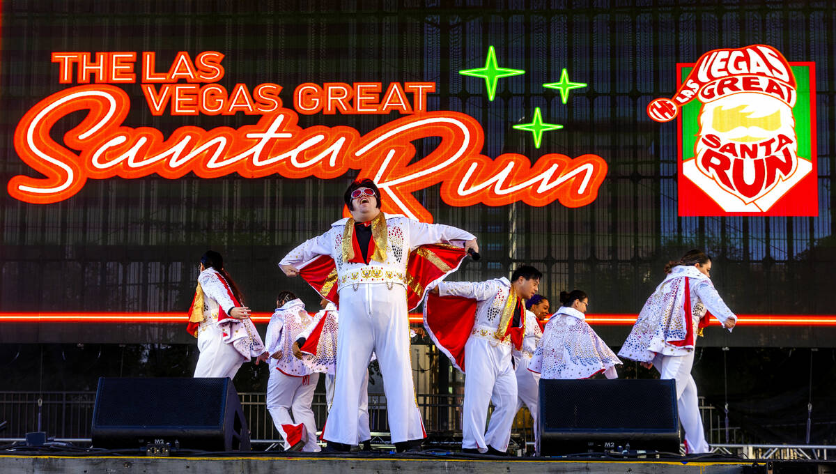 The OV Elvi perform on stage at the Downtown Las Vegas Events Center before thousands of Santas ...