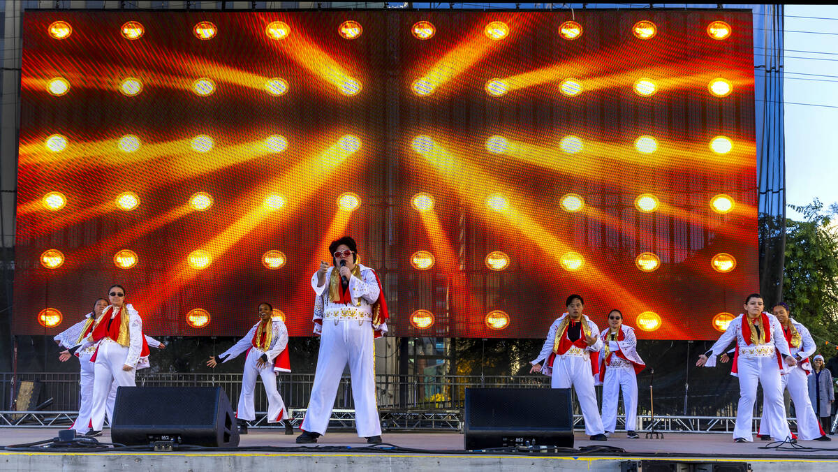 The OV Elvi perform on stage at the Downtown Las Vegas Events Center before thousands of Santas ...