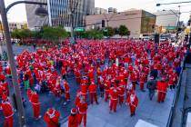 Entrants gather about E. Bridger Avenue and the start line for the Las Vegas Great Santa Run th ...