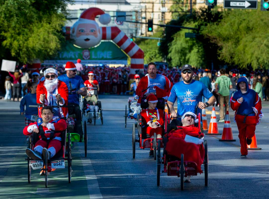 Some of the first entrants make their way along E. Bridger Avenue from the starting line for th ...