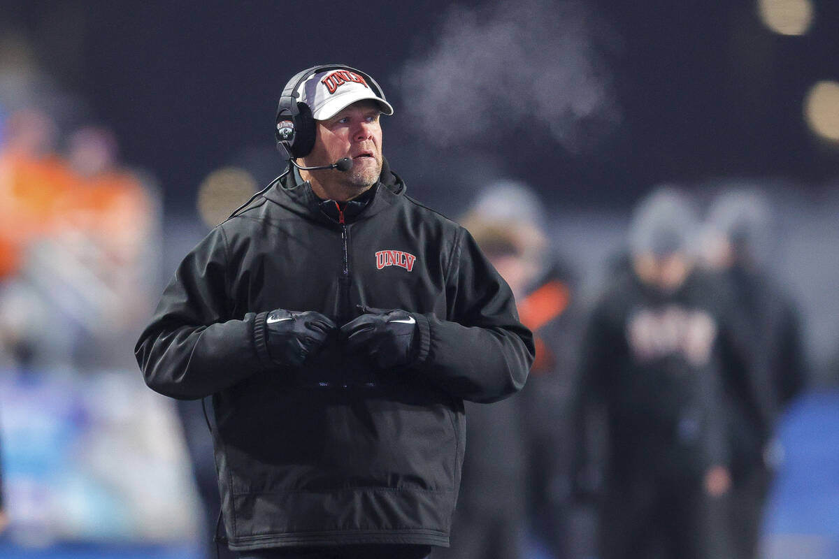 UNLV head coach Barry Odom looks on from the sideline during a timeout in the first half of the ...