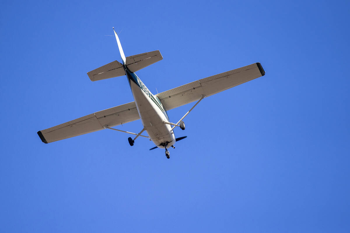 A plane successfully takes flight after it emergency landed on Kyle Canyon Road, Saturday, Dec. ...