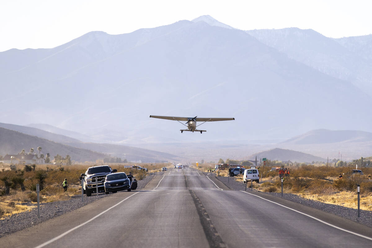 A plane successfully takes flight after it emergency landed on Kyle Canyon Road, Saturday, Dec. ...