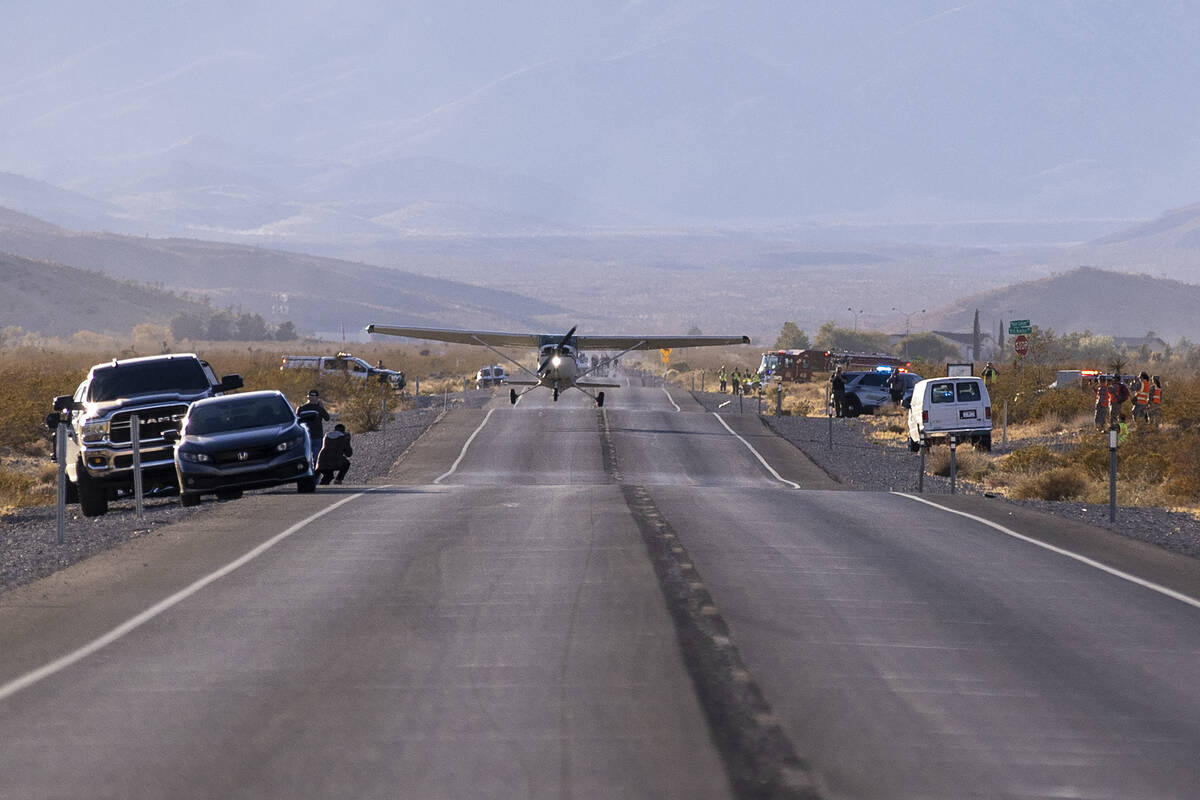 A plane successfully takes flight after it emergency landed on Kyle Canyon Road, Saturday, Dec. ...