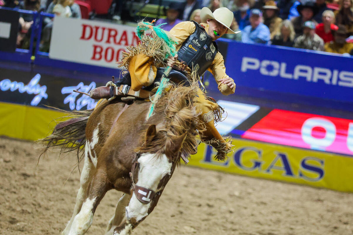 Saddle Bronc rider Brody Cross completes his ride during round three of the National Finals Rod ...