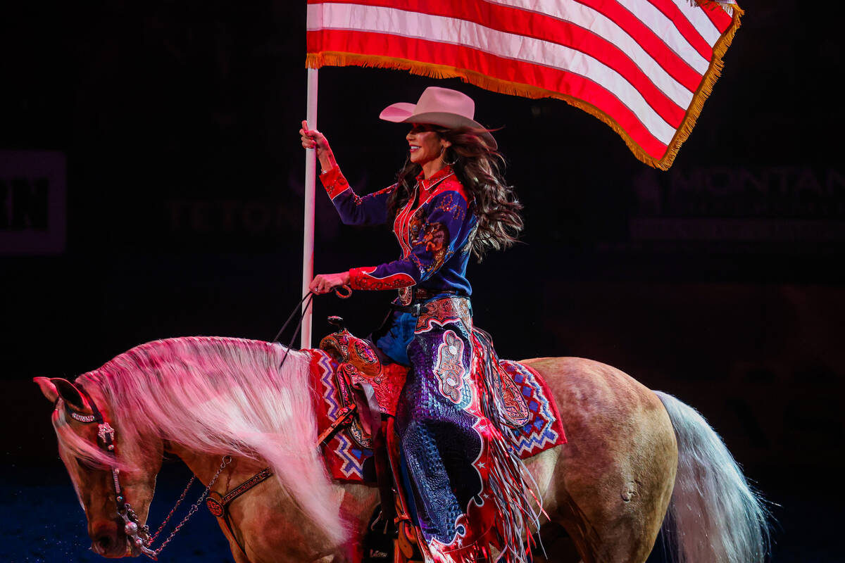 South Dakota Governor Kristi Noem presents the flag during the national anthem during round thr ...