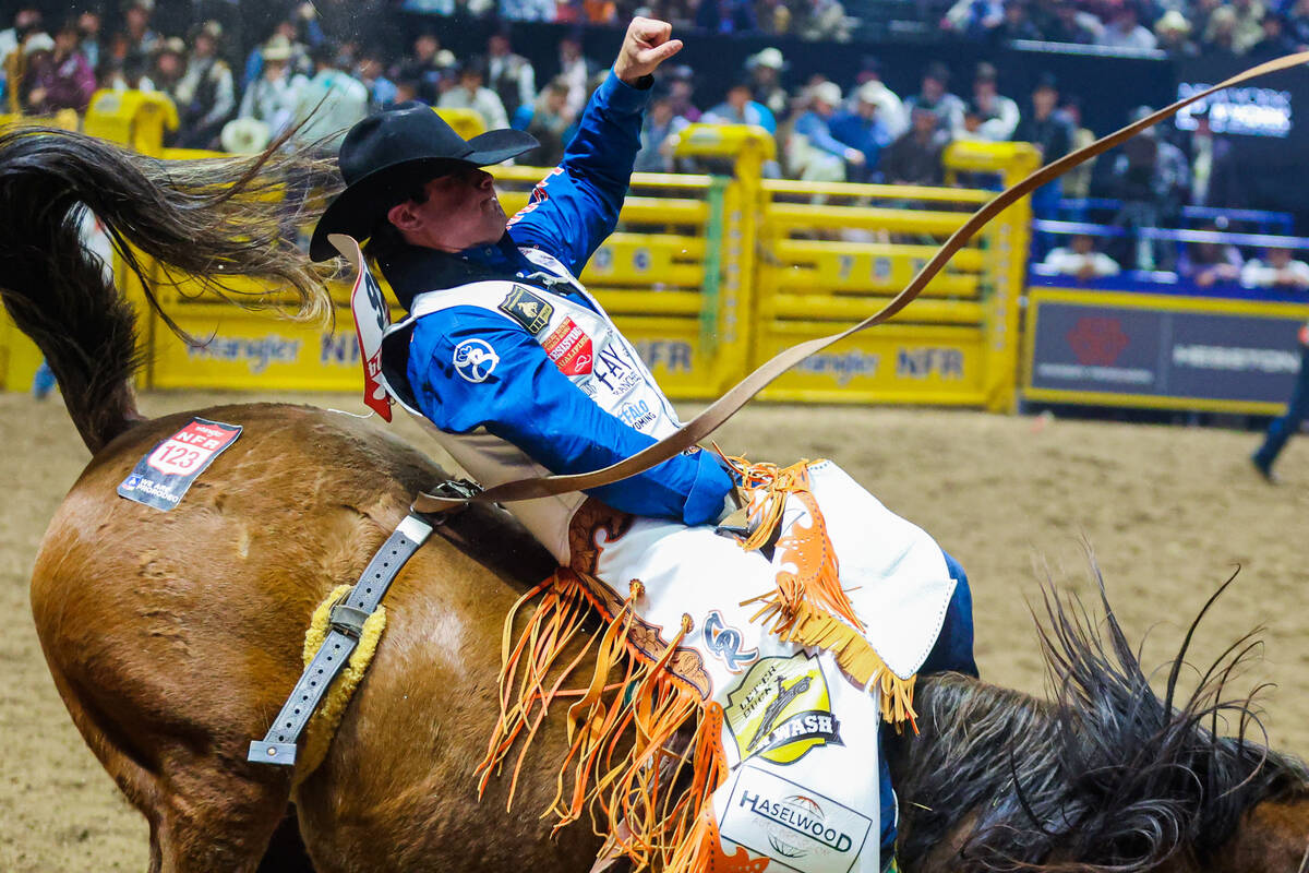 Bareback rider Cole Reiner stays on for his eight seconds during round three of the National Fi ...