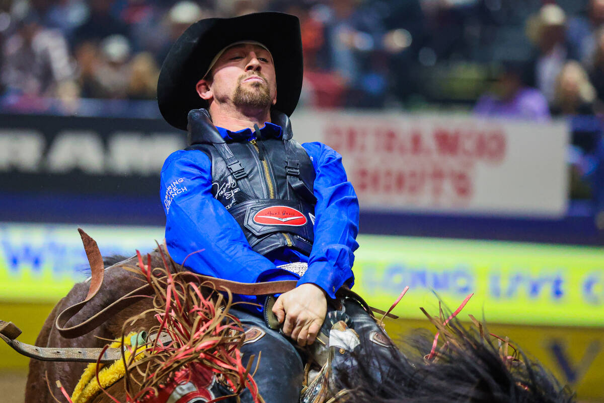 Bareback rider Garrett Shadbolt completes his ride during round three of the National Finals Ro ...