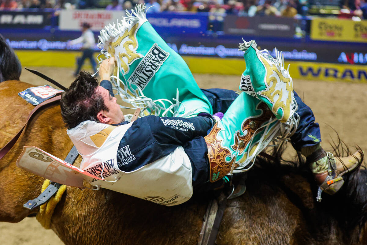 Bareback rider Bradlee Miller keeps his grip on Captain Hook during round three of the National ...