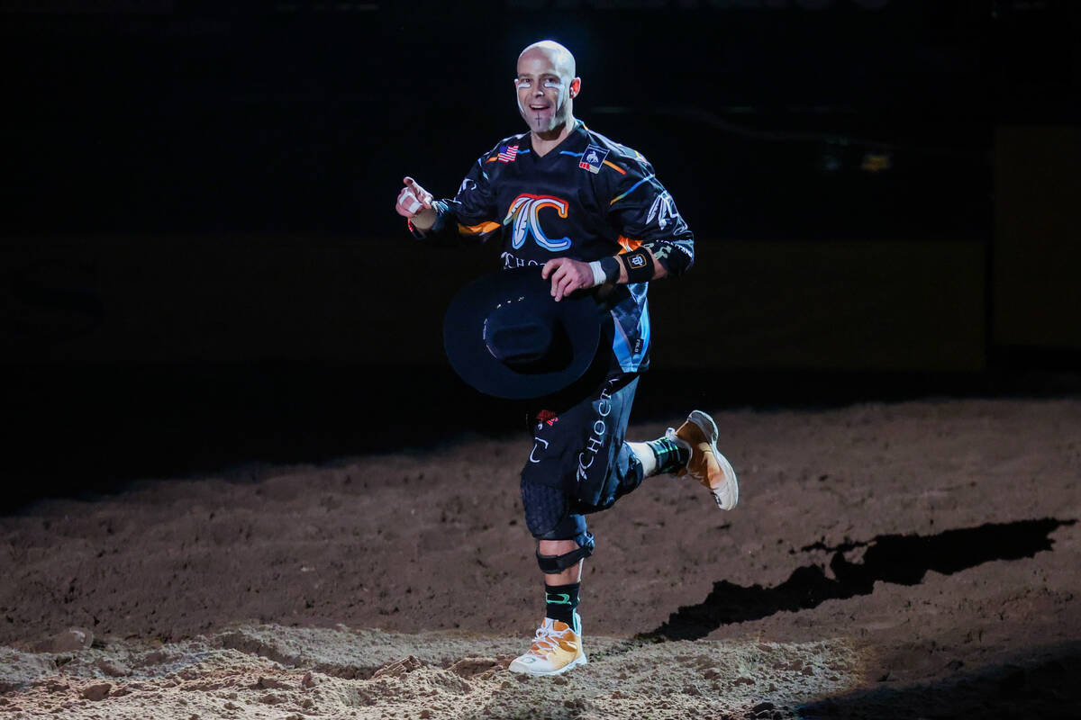 Famed bull fighter Dusty Tackiness runs onto the dirt during round three of the National Finals ...