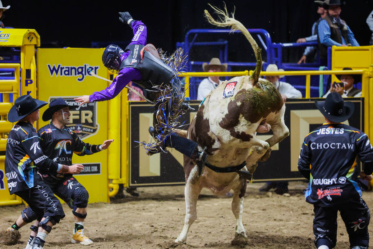 Bull rider Hayes Weight falls off Tomahawk during round three of the National Finals Rodeo at t ...