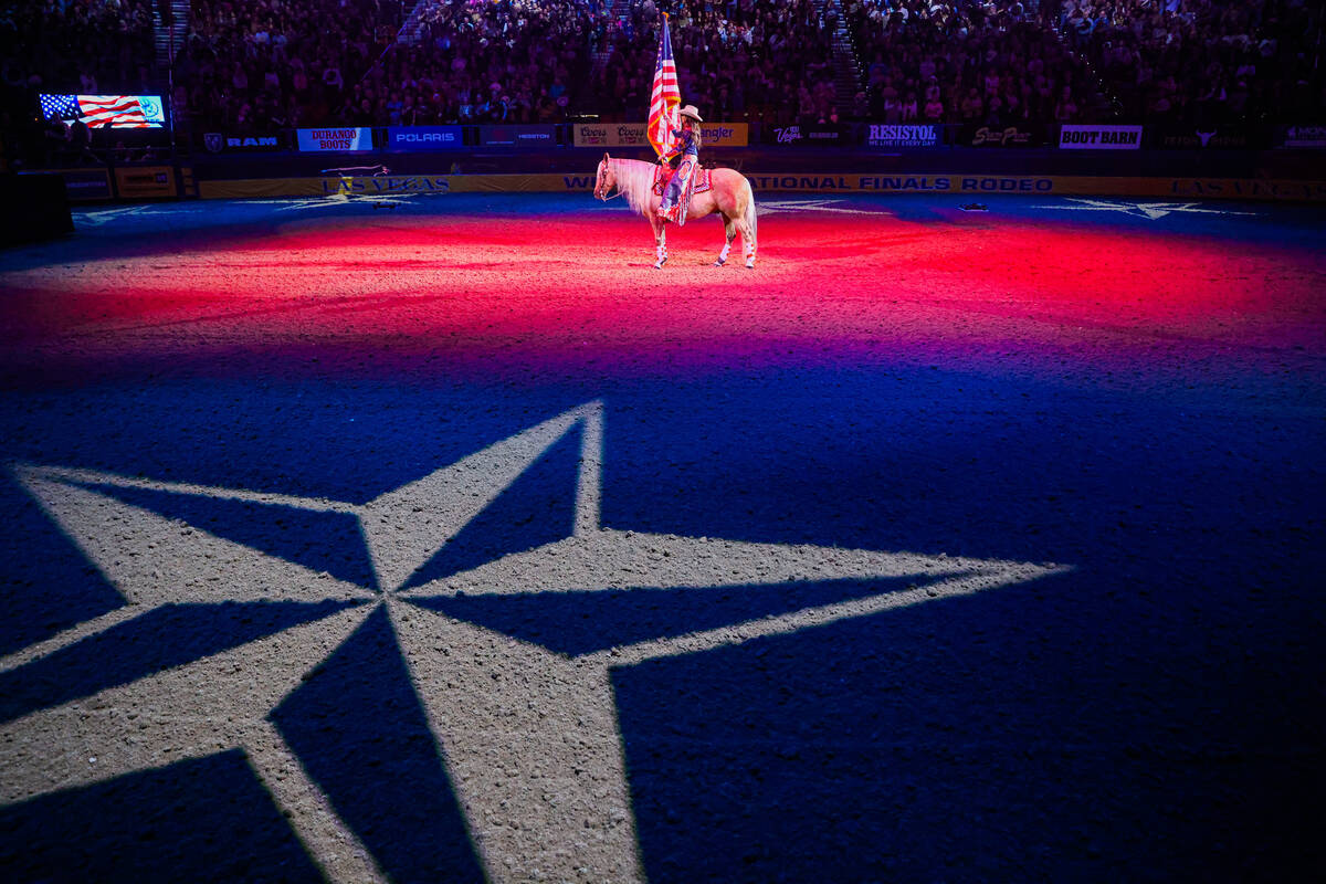 South Dakota Governor Kristi Noem presents the flag during the national anthem during round thr ...