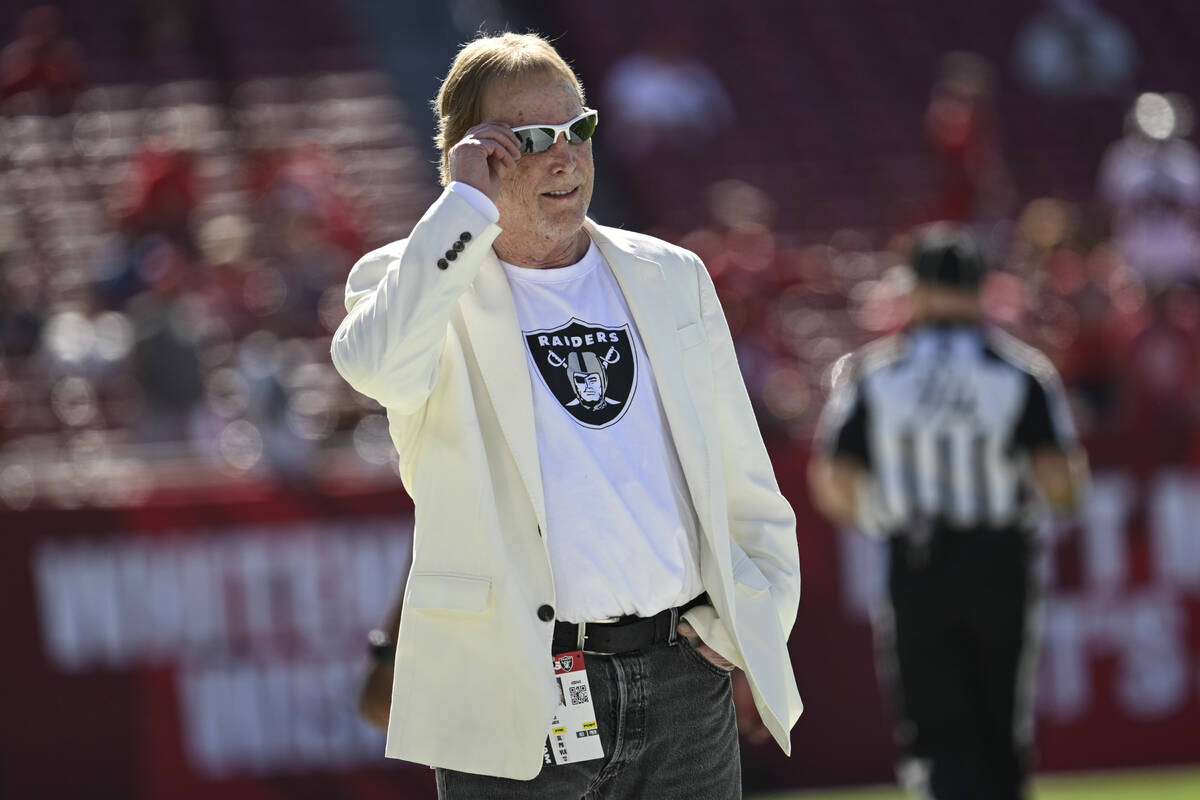 Las Vegas Raiders owner Mark Davis walks the field before an NFL football game against the Tamp ...