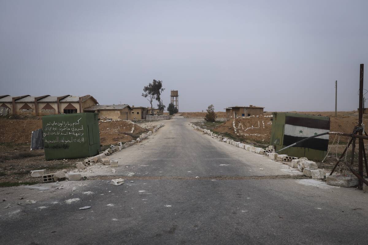 A Syrian army checkpoint stands abandoned near the Abu al-Duhur military airport, east of Idlib ...