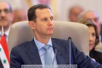 FILE - In this photo provided by Saudi Press Agency, SPA, Syrian President Bashar Assad listens ...