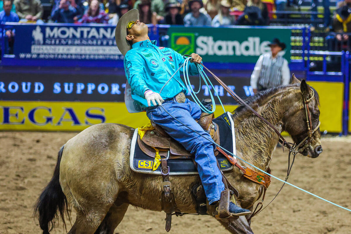 Team roper Junior Nogueira reacts after missing a calf’s foot during round four of the N ...