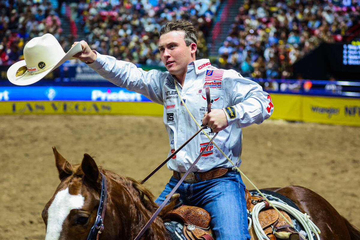 Tie-down roper Riley Webb takes his victory lap during round four of the National Finals Rodeo ...