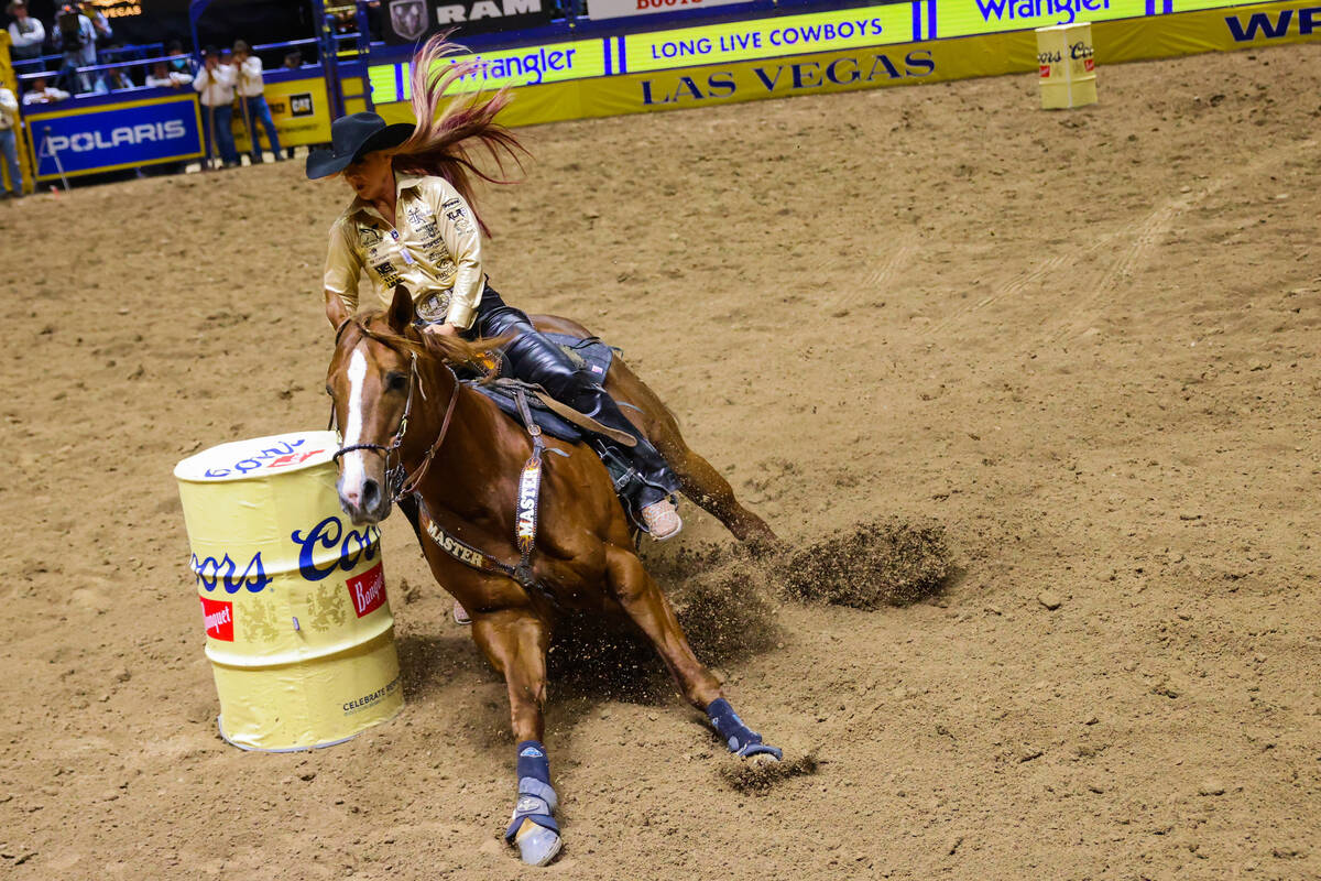 Barrel racer Leslie Smalygo rounds a barrel during round four of the National Finals Rodeo at t ...