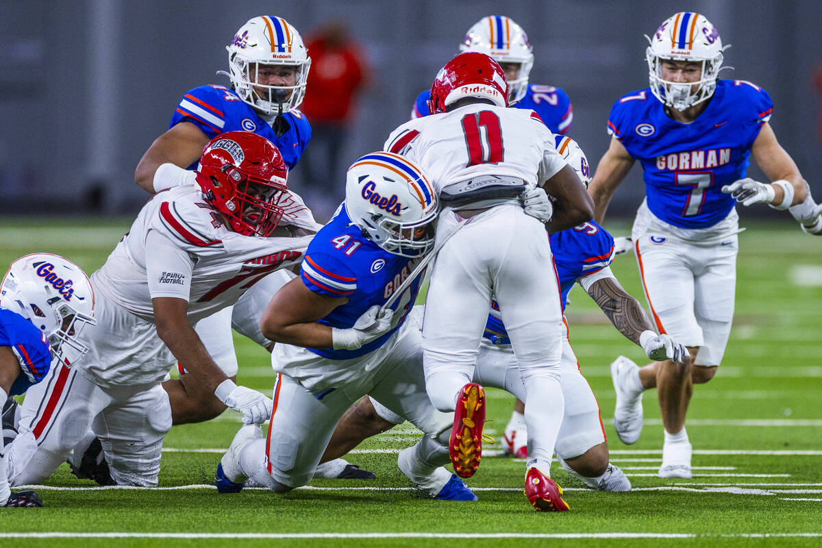 Arbor View running back Kamareion Bell (0) is stopped by Bishop Gorman defensive lineman Prince ...