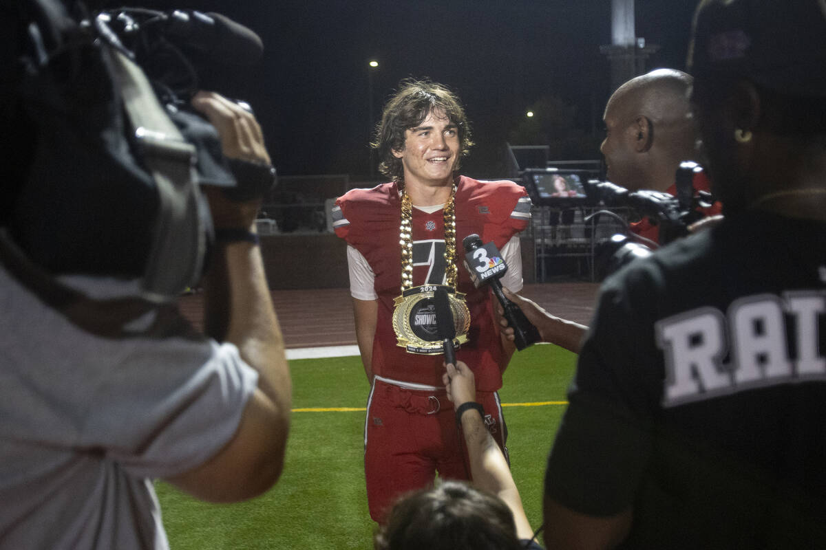 Arbor View quarterback Thaddeus Thatcher (7) is awarded the Raiders High School Showcase Most O ...