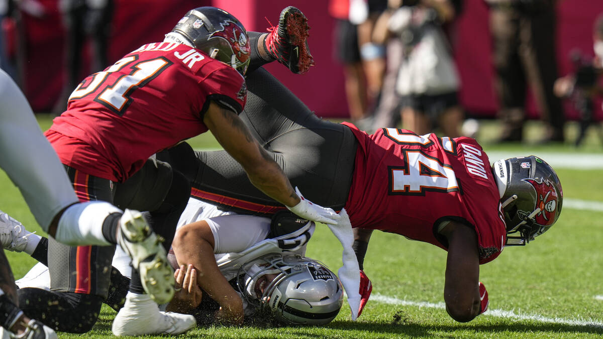 Tampa Bay Buccaneers linebacker Lavonte David (54) and safety Antoine Winfield Jr. (31) sack La ...