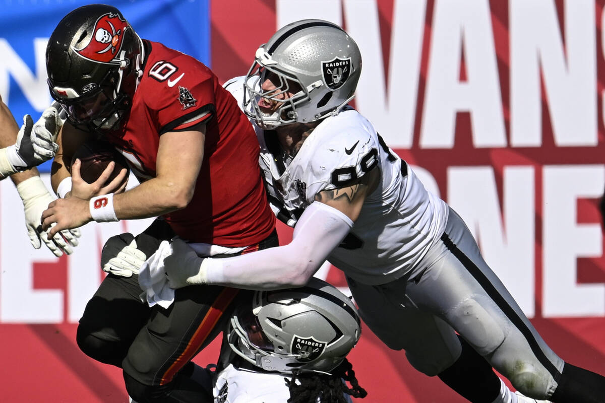 Tampa Bay Buccaneers quarterback Baker Mayfield (6) is sacked by Las Vegas Raiders defensive ta ...